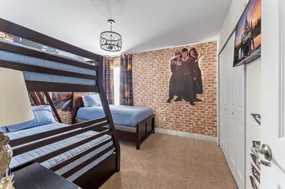 a bedroom with two bunk beds and a mural of two women at 5BR Themed Bedrooms at Storey Lake SL4702 in Kissimmee