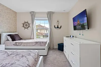a bedroom with two beds and a window at Cute with Private Pool at Storey Lake SL4802 in Kissimmee
