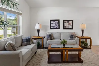 a living room with a couch and a coffee table at Ground floor spacious house 4BR VP2512 in Kissimmee