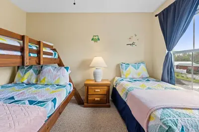 a bedroom with two beds and a window at Relaxing 3BR Haven for 8 at Seven Dwarfs SD2610 in Kissimmee