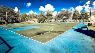 an empty basketball court with water on it at Relaxing 3BR Haven for 8 at Seven Dwarfs SD2610 in Kissimmee