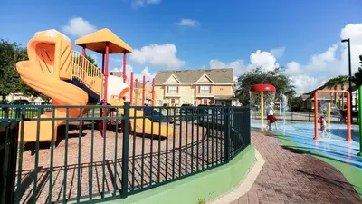 a playground with a slide and a slidesktop at Relaxing 3BR Haven for 8 at Seven Dwarfs SD2610 in Kissimmee