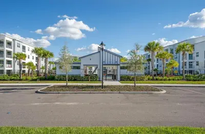 an empty parking lot in front of a building at 2 BR Modern Apt near Disney SL4741 in Kissimmee