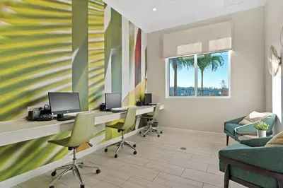 an office with two desks and chairs and palm trees at 2 BR Modern Apt near Disney SL4741 in Kissimmee