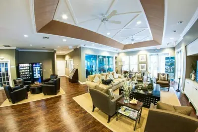 a large living room with couches and chairs at 5372 Lovely home inside Disney area in Kissimmee