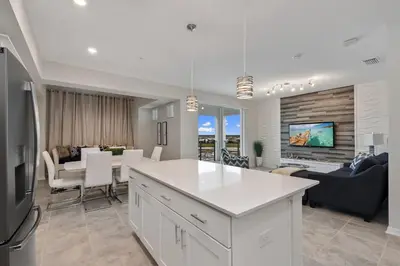 a kitchen and living room with a dining room at 3120 BRAND NEW stunning apartment in Kissimmee