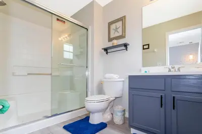 a bathroom with a toilet and a shower and a sink at 8553 Stunning house close to Animal Kingdom in Kissimmee