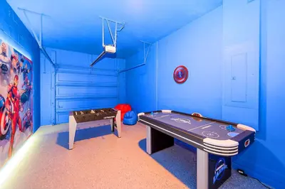 a blue room with a ping pong table in it at Bright & Airy 5BR Resort Home with Pool in Kissimmee