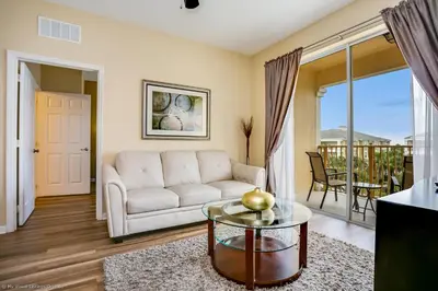 a living room with a couch and a table at 4814 Cayview Avenue #401 in Orlando