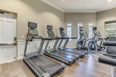 a fitness room with treadmills and cardio machines at 4814 Cayview Avenue #401 in Orlando