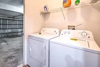 a laundry room with a washer and dryer at Sunny Clermont Retreat with Lanai 12 Mi to Disney! in Orlando