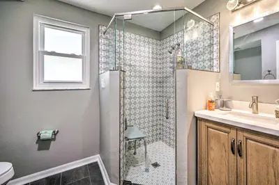a bathroom with a shower and a sink and a toilet at Sunny Clermont Retreat with Lanai 12 Mi to Disney! in Orlando