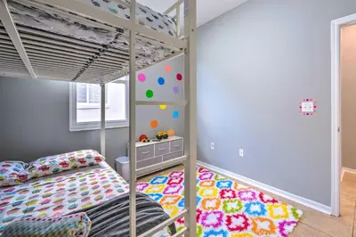 a bedroom with a bunk bed and a play room at Sunny Clermont Retreat with Lanai 12 Mi to Disney! in Orlando