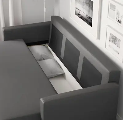a gray bench with a box on it in a room at Lovely Studio near Universal in Orlando