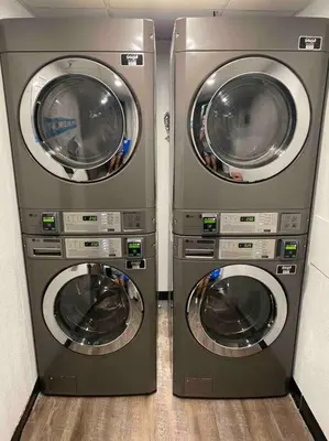 two washing machines sitting next to each other at Lovely Studio near Universal in Orlando