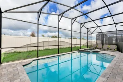 a swimming pool with a retractable roof and a swimming poolvisor at Darth's Manor 9 Bed 6 Bath Huge Home Solara Resort villa in Orlando