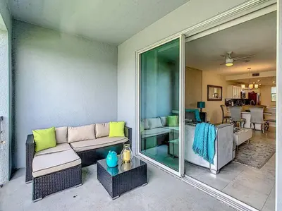 a living room with a couch and a table at Last minute deal! Brand New 2bed apt near Disney in Kissimmee