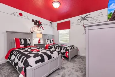 two beds in a bedroom with red ceilings at Monopoly Fun Storey Lake Resort 6 Bed Star Home! villa in Kissimmee