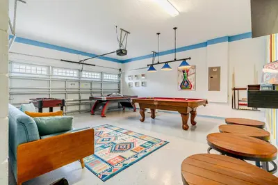 a living room with a pool table and ping pong tables at Encore Resort 5 Bedroom Home with Pool 2201 in Orlando