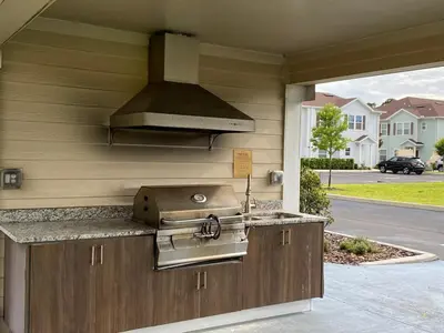 a kitchen with a sink and a stove at Super Comfy and Spacious 3 Bedroom 15-20 minutes from Disney, with major shopping 4 minutes away in Kissimmee