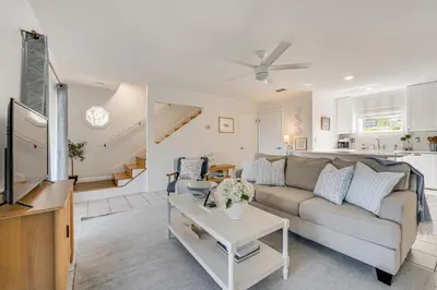 a living room with a couch and a table at Lakefront Retreat with Kayaks and Fire Pit in Clermont in Clermont