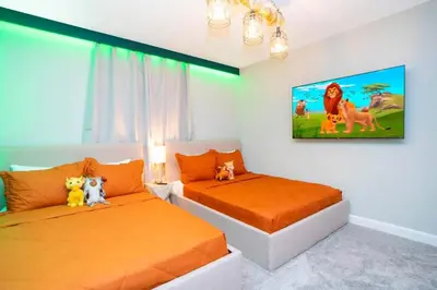 a bedroom with two beds with stuffed animals on them at Gorgeous 4Bd w/ Pool Close to Disney @ Storey Lake 4289 in Kissimmee