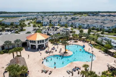 an aerial view of a pool at a resort at Gorgeous 4Bd w/ Pool Close to Disney @ Storey Lake 4289 in Kissimmee
