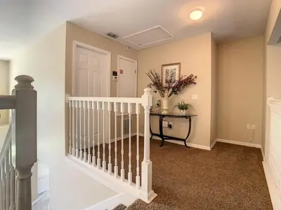 a white staircase in a home with a white door at Fantastic 7 Bed 6 Bath in Prestigious Gated Comm, villa in Orlando