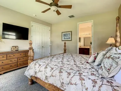 a bedroom with a bed and a ceiling fan at Fantastic 7 Bed 6 Bath in Prestigious Gated Comm, villa in Orlando