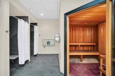 a bathroom with a shower and a walk in shower backdoor at 3BR Condo with Pool - Near Disney in Orlando