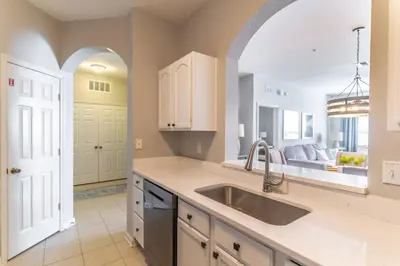 a kitchen with a sink and an archway at 2788 Windsor Hills in Orlando