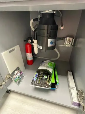 a kitchen shelf with a coffee pot and food at Lovely 1 bedroom Condo with pool in Orlando