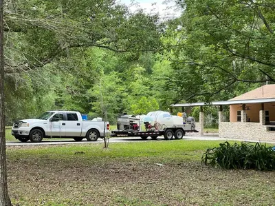 a white truck parked in front of a house at The Piano House in Orlando