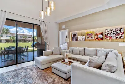 a living room with a couch and a table at Cozy Home Resort Community Disney 5 Min in Orlando