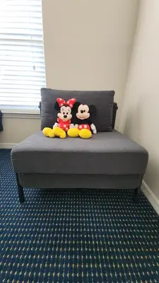 two hello kitty stuffed animals sitting on a bed at My Home in Orlando in Kissimmee