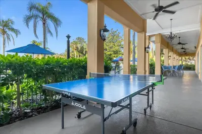 a ping pong table on a tennis court at 3 Bedrooms 25 Bathrooms Encantada 3091 Yl in Orlando