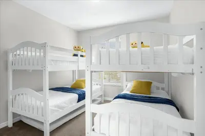 two white bunk beds in a white room at 3 Bedrooms 25 Bathrooms Encantada 3091 Yl in Orlando
