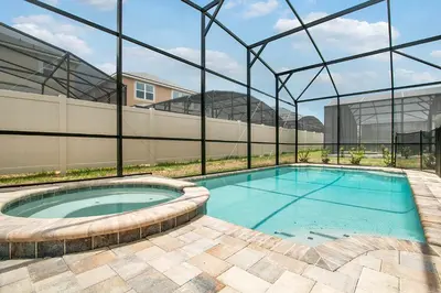 a large swimming pool in a building with a building at 7 Bedrooms 65 Bathrooms Solara 9024 Fk in Orlando