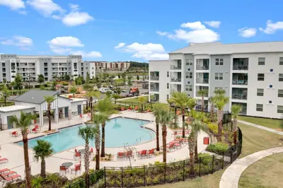 an aerial view of a resort with a pool and palm trees at 2 Bedrooms 2 Bathrooms Storey Lake 3150-404 Pc in Kissimmee
