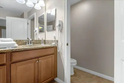 a bathroom with a sink and a toilet at 4 Bedrooms 3 Bathrooms Storey Lake 3195 Pp in Orlando