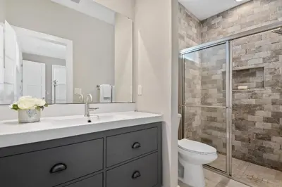 a bathroom with a sink and a toilet and a shower at Centrally Located Guest Suite Retreat in Orlando