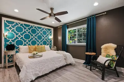 a bedroom with a bed and a ceiling fan at 5Bd 4Bath villa, amazing outdoor space, pet friendly in Orlando