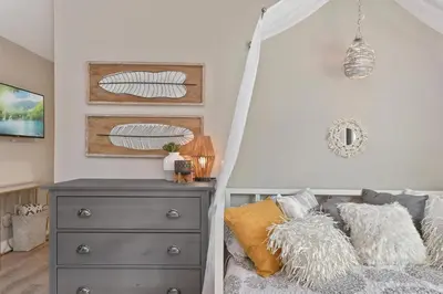 a bedroom with a bed with a canopy at Bohemian Retreat in the Heart of Orlando in Orlando