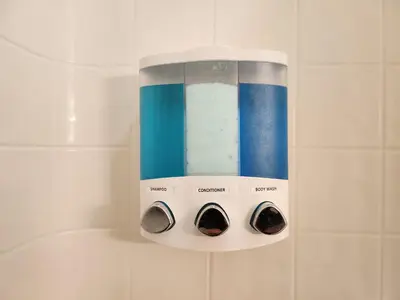a shelf in a bathroom with four different items at Fully Renovated, Quiet, Spacious Disney Themed Pool Home with Office in Kissimmee