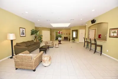 a large living room with a couch and chairs at Lakeside 4-Bed Pool Home at Villa Sol home in Kissimmee