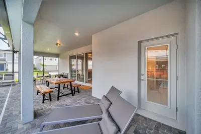 a living room with a couch and a table at 8 Bedroom 6 Bathroom Resort Home villa in Kissimmee