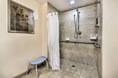 a bathroom with a shower with a shower curtain at Disney Good Neighbor Resort Condo Less Than 4 Mi to WDW! in Orlando