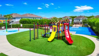 a playground with a slide in a park at Alluring Home With Private Pool Near Disney With Waterpark Resort Access At Encore Resort - 7732Ff in Kissimmee