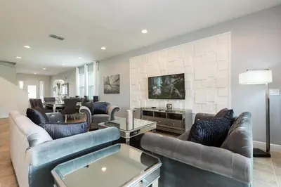 a living room with couches and a tv at Alluring Home With Private Pool Near Disney With Waterpark Resort Access At Encore Resort - 7732Ff in Kissimmee
