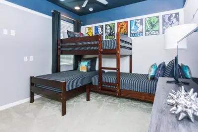 a room with two bunk beds and a desk at Magical Retreat: Luxurious Home near Disney World in Kissimmee